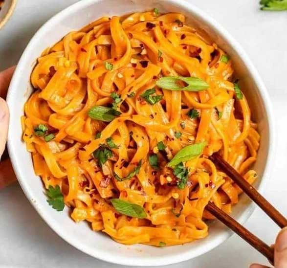 Delicious bowl of Thai Red Curry Noodles with vibrant colors and fresh ingredients.