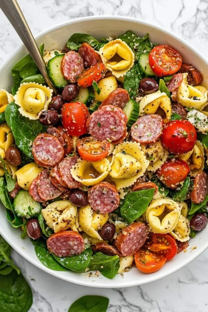 Delicious Tortellini Pasta Salad with fresh vegetables and herbs