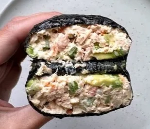 Paleo tuna salad nori wraps filled with fresh ingredients and served on a plate.