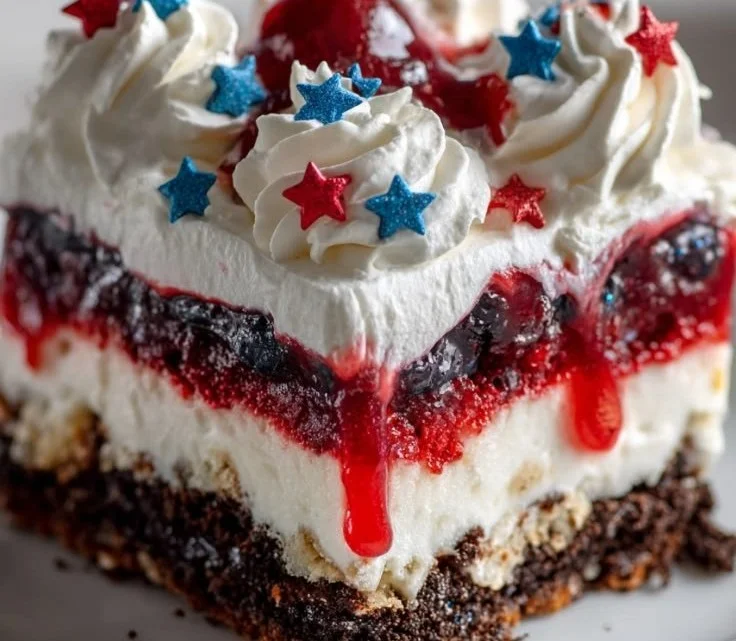 Colorful 4th of July dessert lasagna with red, white, and blue layers
