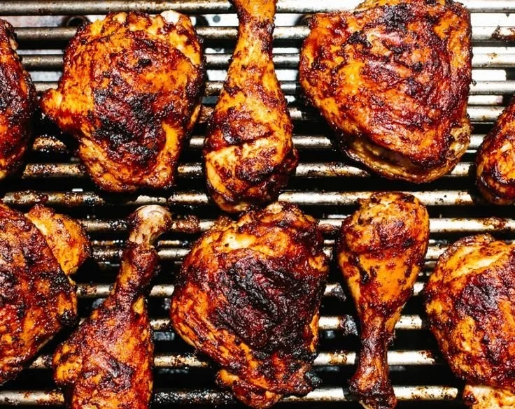 Juicy BBQ chicken grilled to perfection, ready to serve with barbecue sauce.