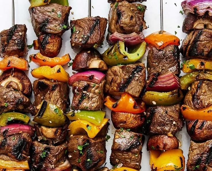 Grilled Beef Shish Kabob skewers with colorful vegetables on a plate