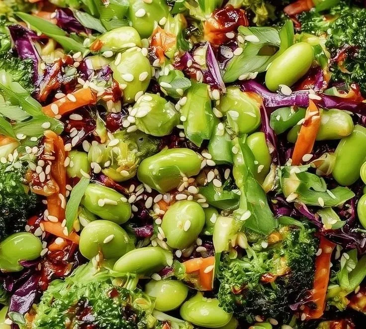 Fresh and colorful broccoli salad with vegetables and dressing