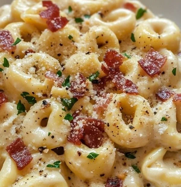 Delicious creamy tortellini carbonara served in a bowl