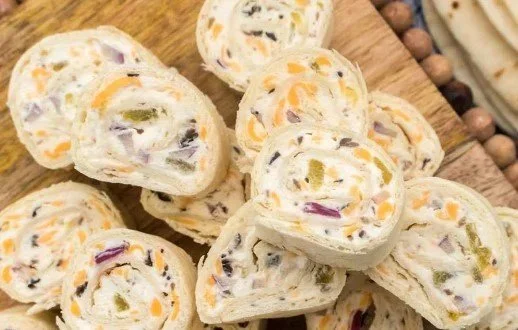 Easy tortilla pinwheels served on a platter with colorful fillings