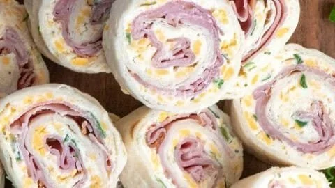 Ham and cheese roll ups served on a plate for a delicious snack