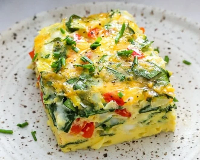 High-protein cottage cheese egg bake dish topped with herbs