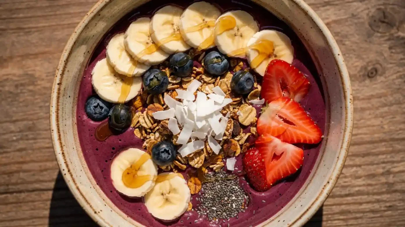Delicious homemade acai smoothie bowl topped with fresh fruits and granola