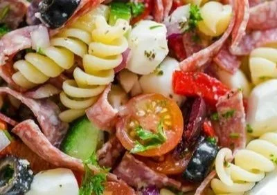 Colorful Italian Pasta Salad with fresh vegetables and dressing