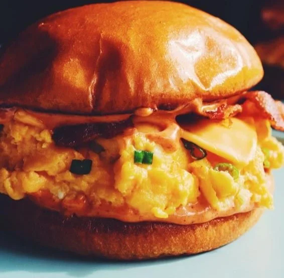 Delicious homemade EggSlut Sandwich knockoff with egg and toppings
