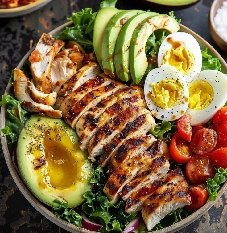 Paleo Grilled Chicken Cobb Salad with Honey Dijon Dressing on a plate