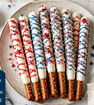 Festive patriotic pretzel rods decorated with red, white, and blue chocolate