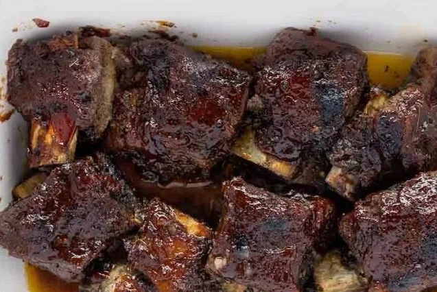 Deliciously tender BBQ beef ribs served on a platter