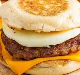 Sausage Egg and Cheese McMuffin served on a breakfast plate