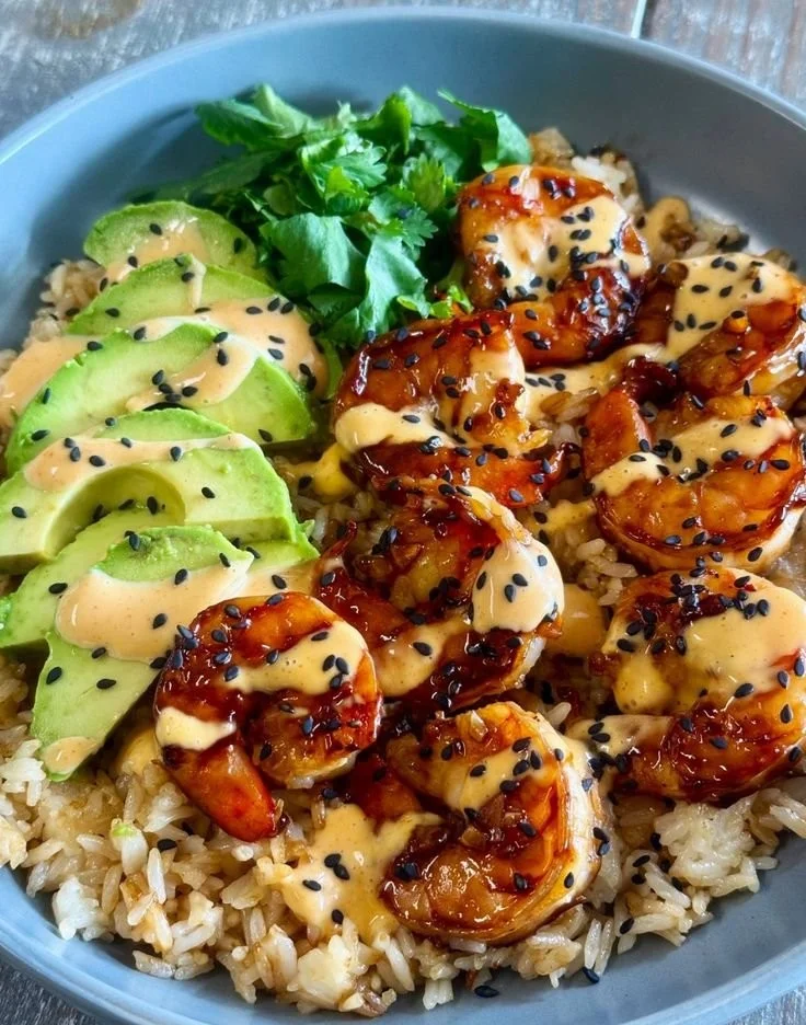 Tasty teriyaki shrimp rice bowl with vegetables and sauce