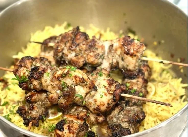 Za'atar Chicken served with rice, a fragrant Middle Eastern dish.