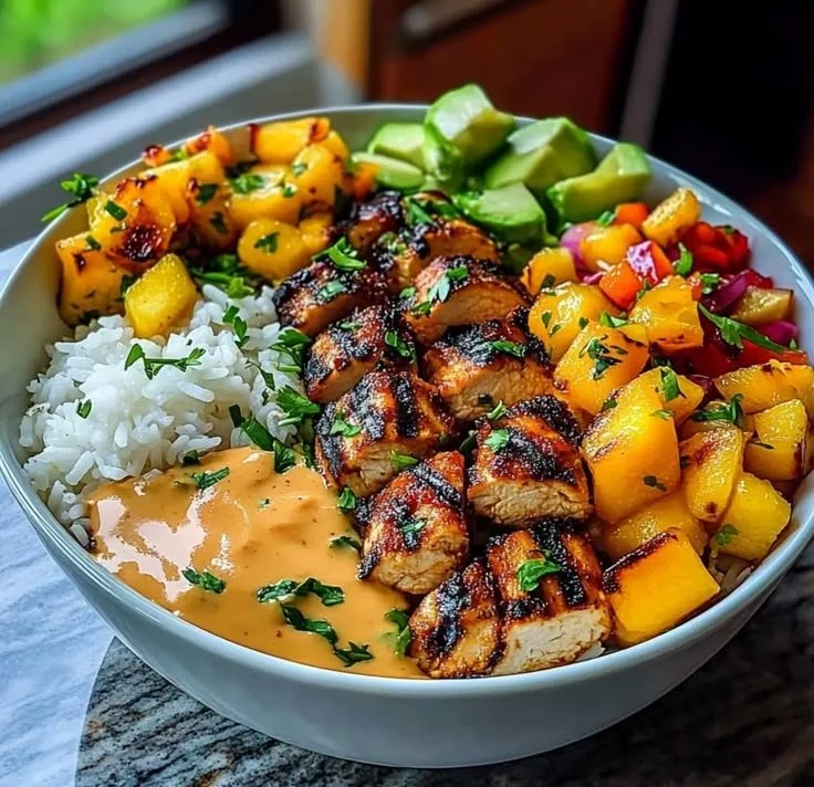 Delicious chicken mango rice bowl served in a vibrant dish